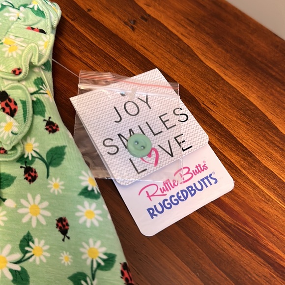 RUFFLE BUTTS Infant Girl Rufflebutts Daisies & Ladybugs Ruffle Detail Romper - Picture 6 of 15